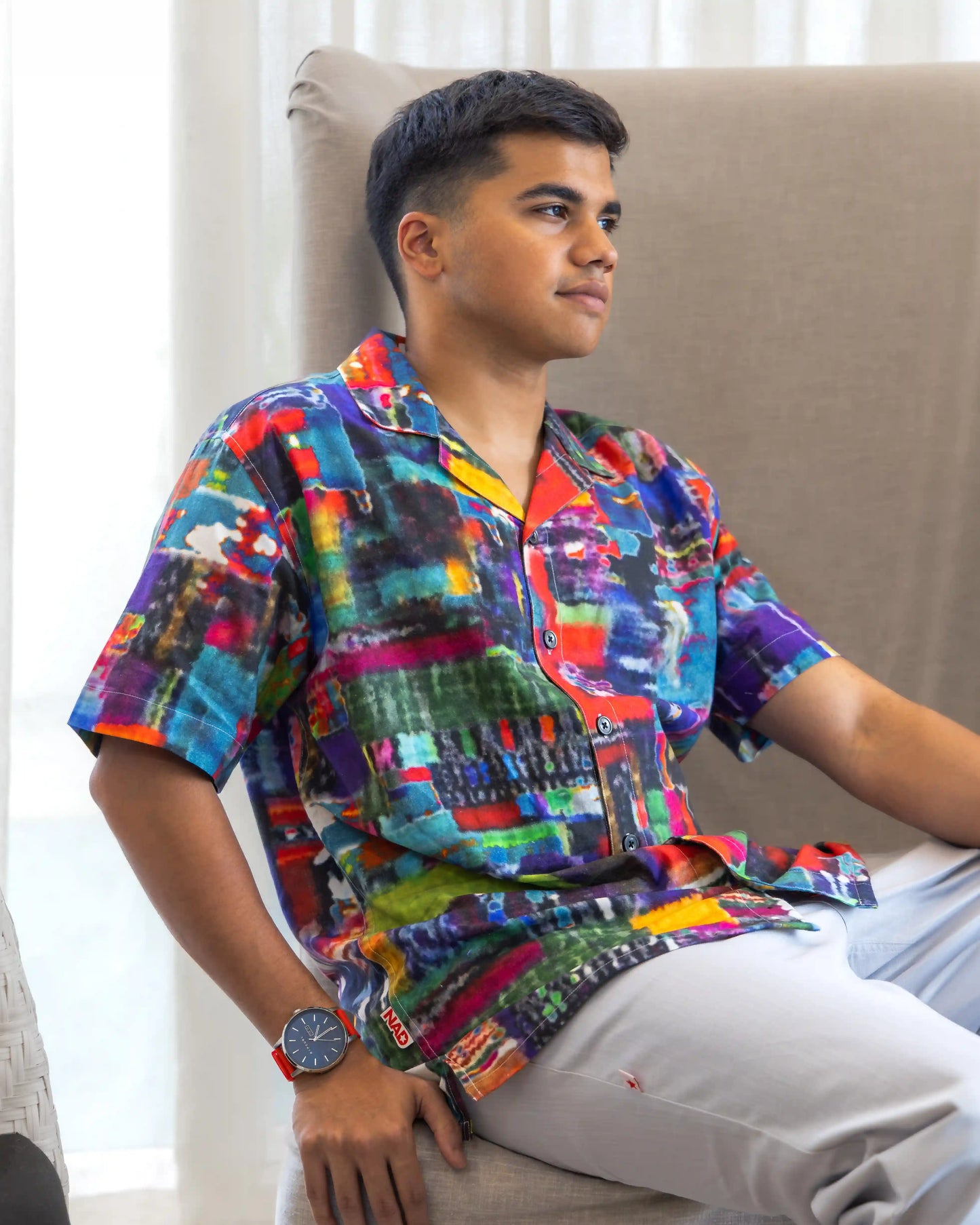 Model in NAD's abstract multi-coloured printed shirt for men.