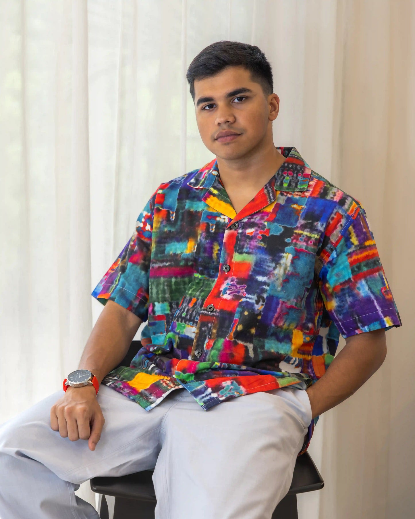 Model in NAD's abstract multi-coloured printed shirt for men.