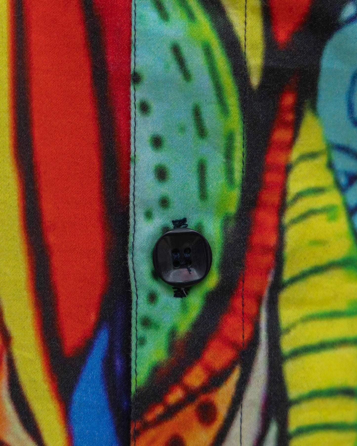 A close-up view of NAD's vibrant African Mamba poplin printed shirt for men.