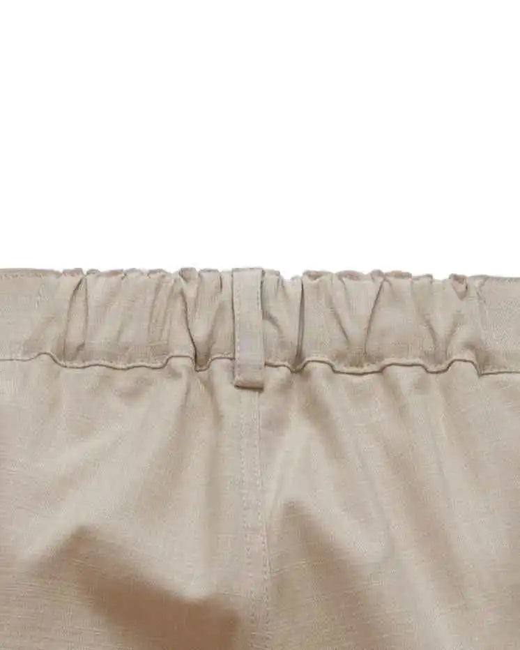Close-up of NAD's beige cotton pants for men.