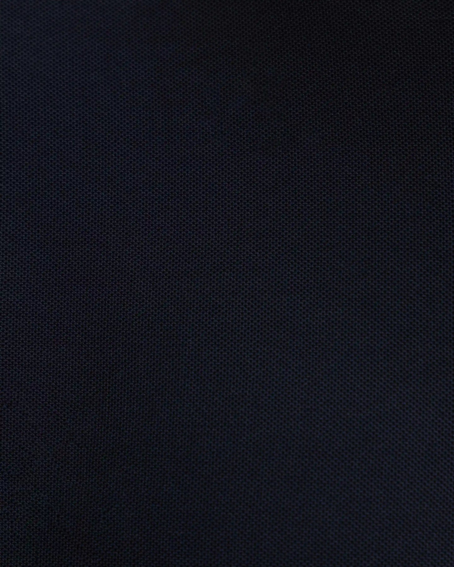 Close-up of NAD's black polyester polo t-shirt for men.