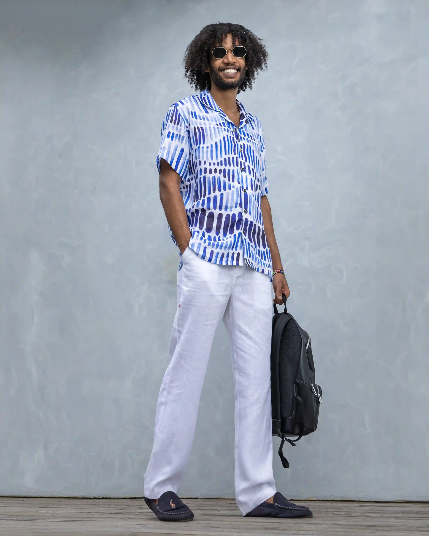 Model dressed in NAD's blue water colour line linen shirt for men.