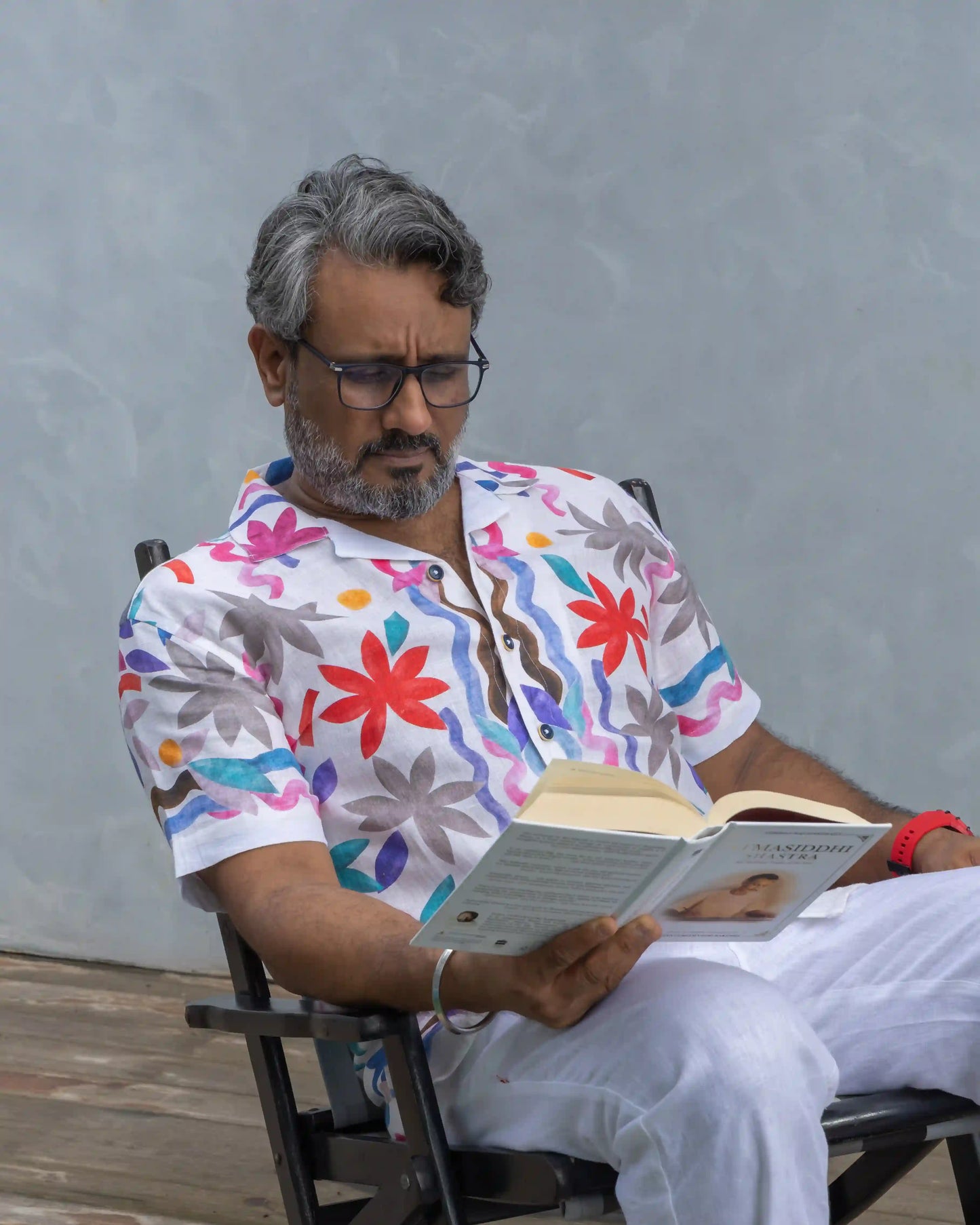 Model dressed comfortably in NAD's multi coloured floral linen shirt for men.