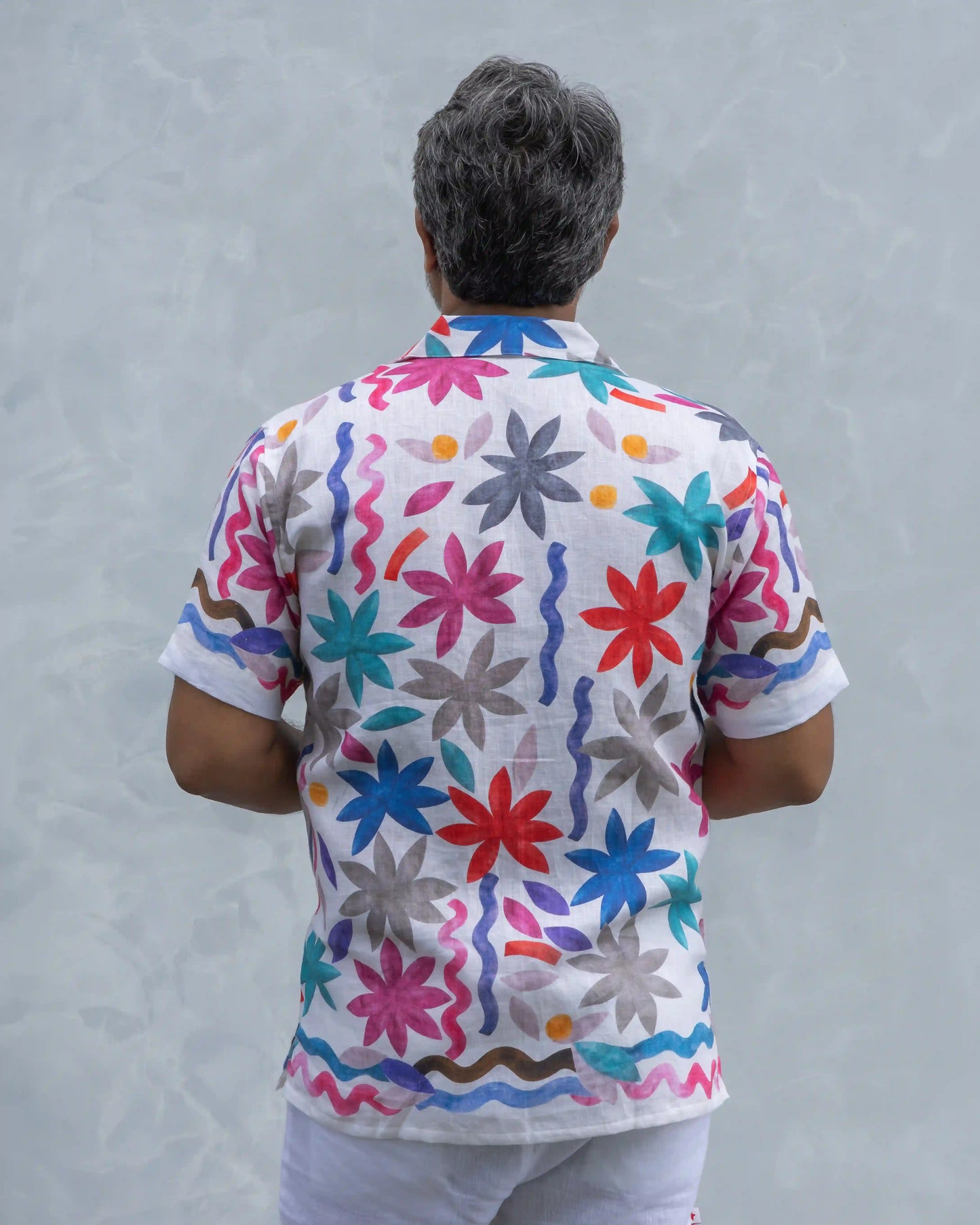 Back shot of NAD's multi-coloured floral linen shirt for men.