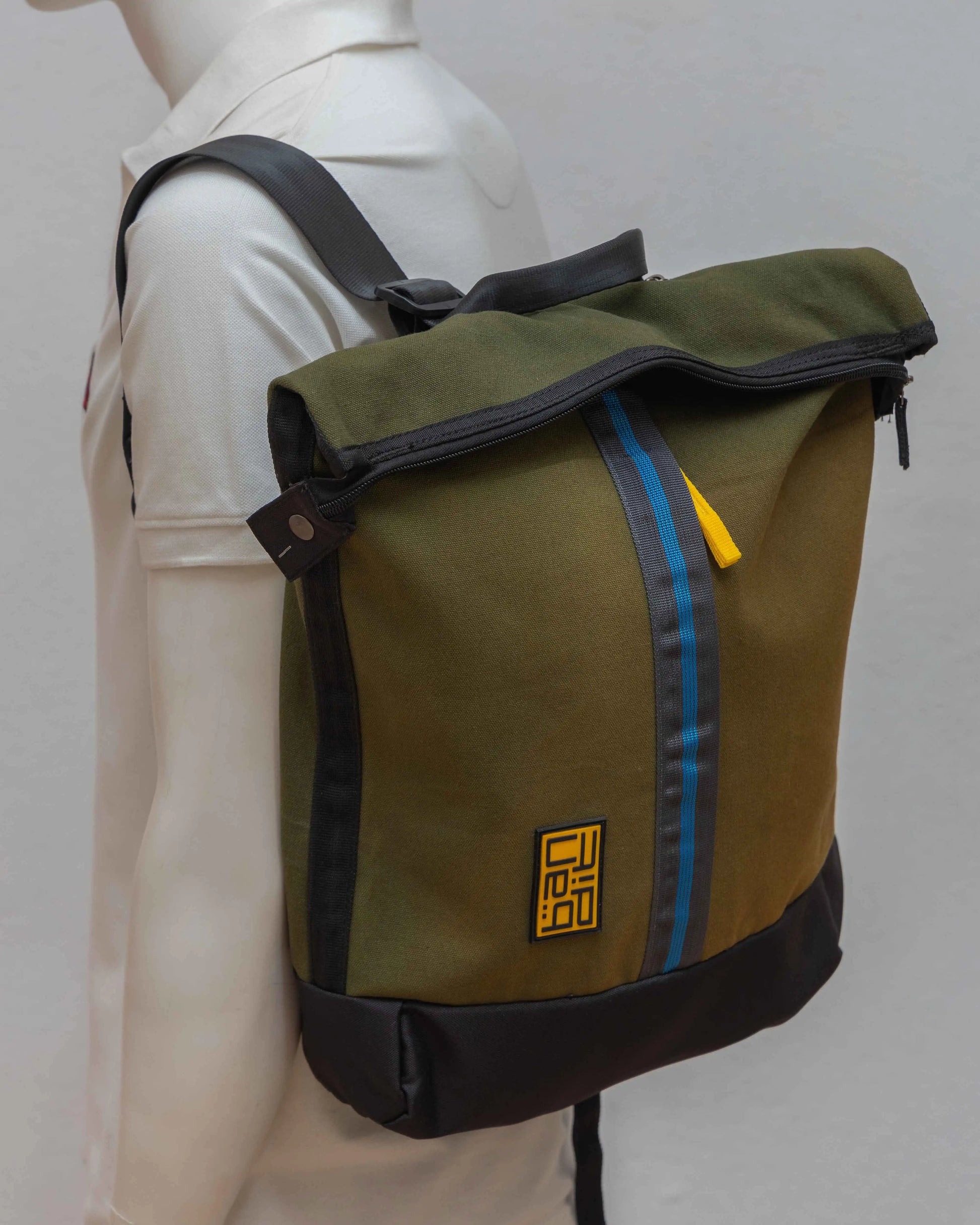 Mannequin displaying NAD's army green backpack for men.