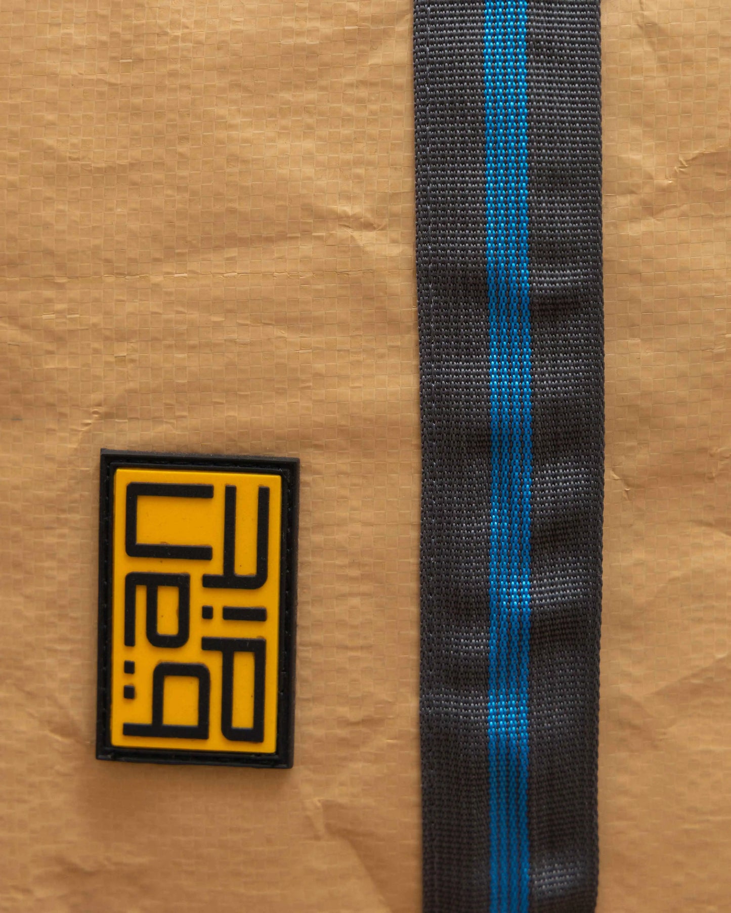 Close-up of design elements on NAD's paper backpack for men.