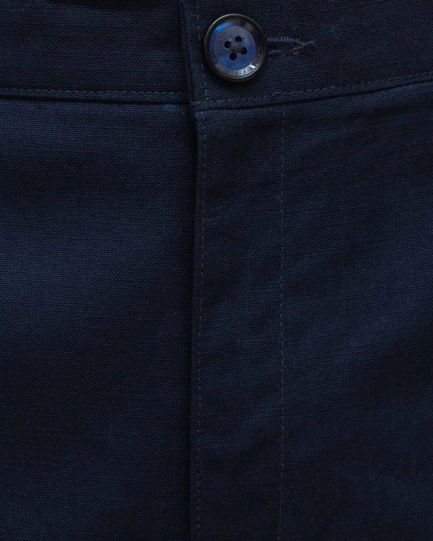 Close-up of NAD's navy blue cotton pants for men.