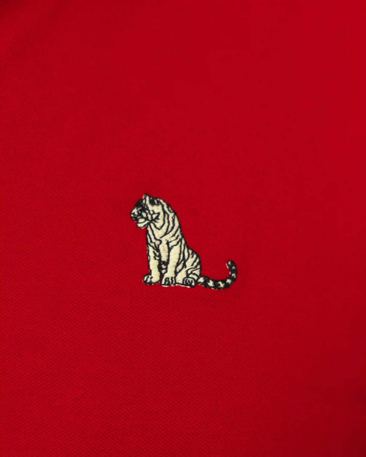 Embroidered tiger design on a red cotton polo men's t-shirt by NAD.