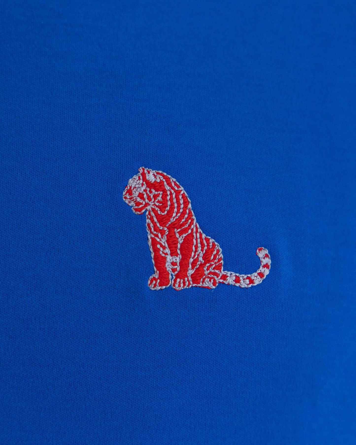 Embroidered tiger on NAD's royal blue cotton jersey crew t-shirt for men.