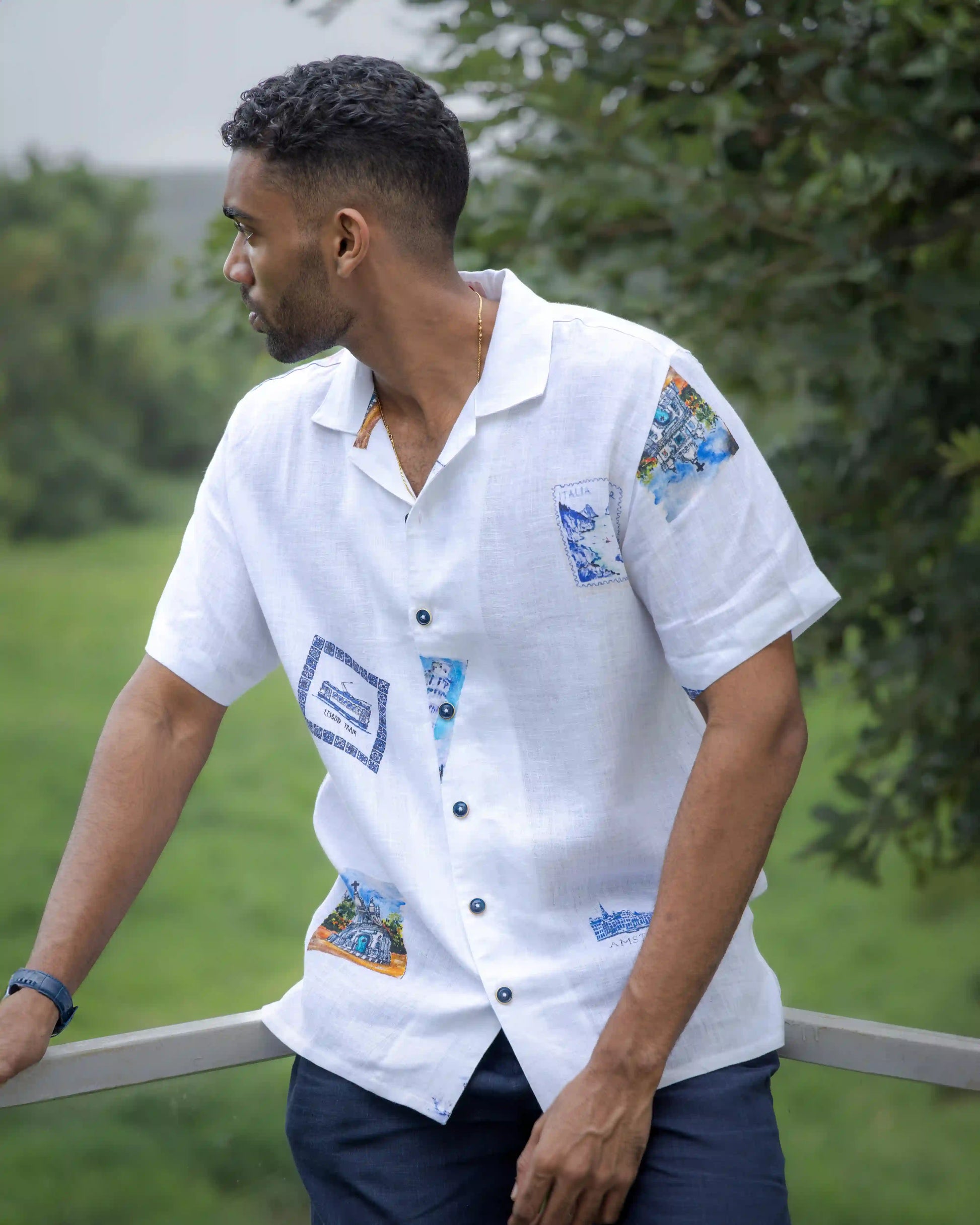 Model dressed in NAD's stamp print linen shirt for men.
