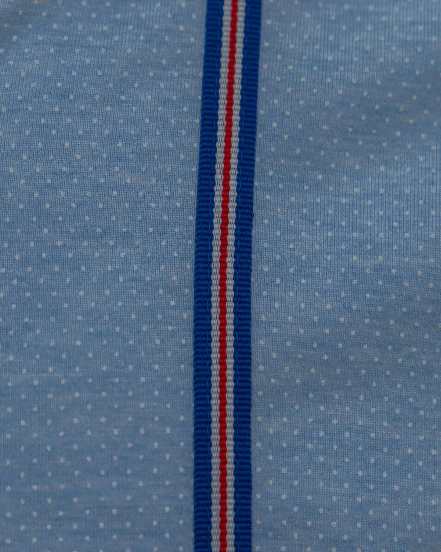 Close-up of blue tapes on NAD's blue cotton jersey shirt for men.