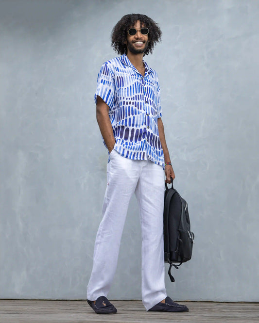 Model dressed in NAD's blue water colour line linen shirt for men. 