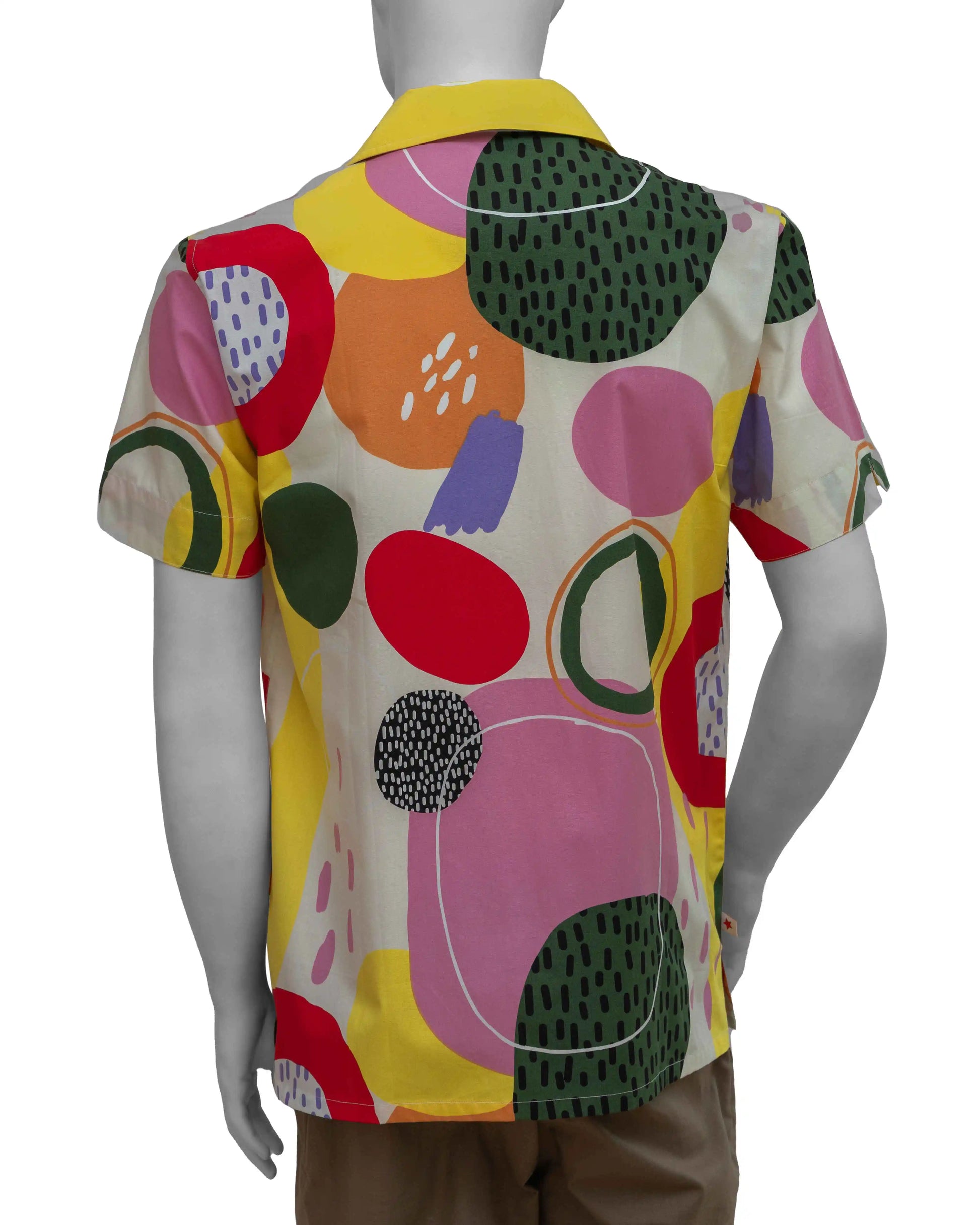 Back shot of a mannequin wearing NAD's distorted circles poplin printed shirt for men. 