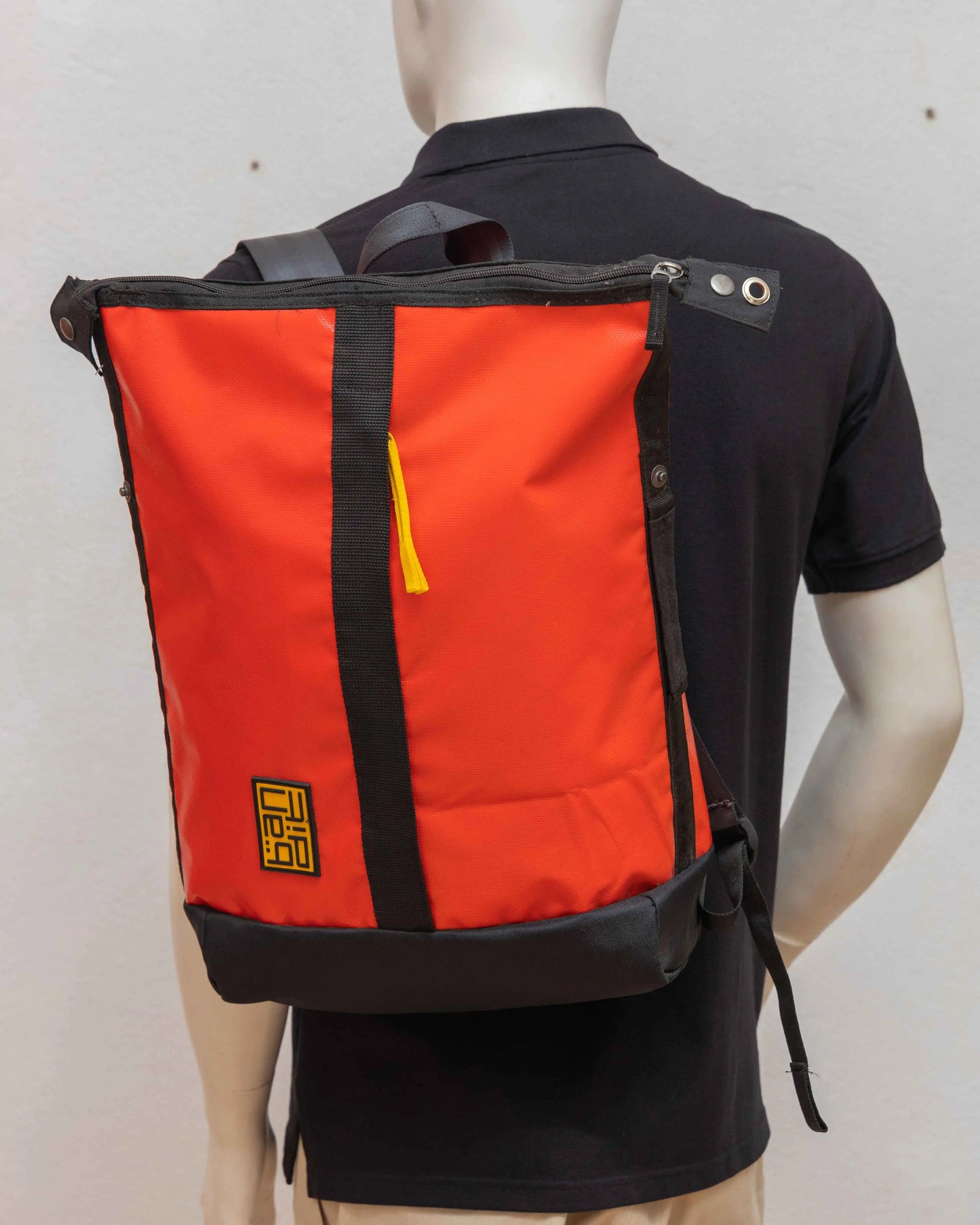 NAD's red backpack for men. 