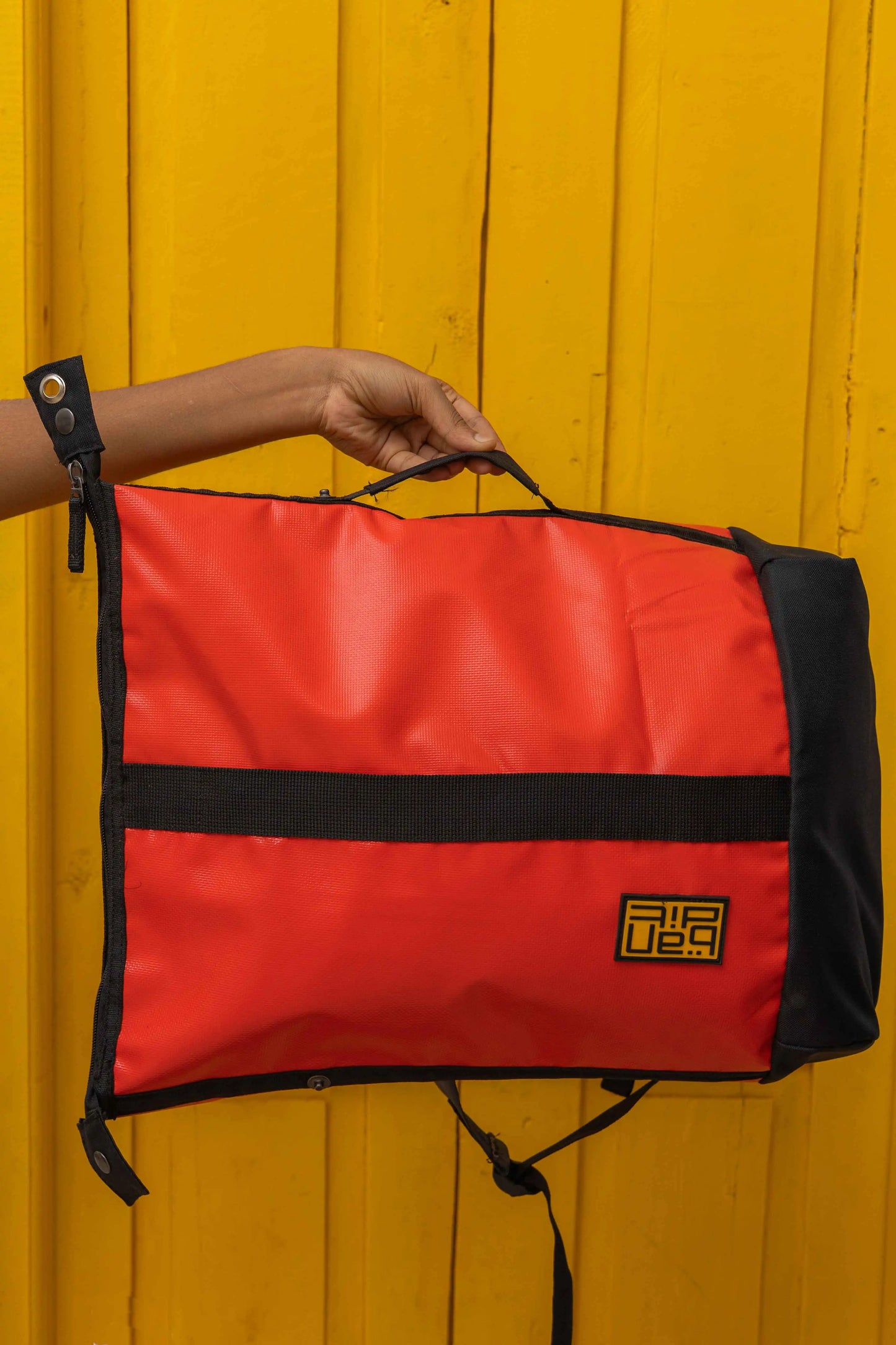 NAD's red backpack for men. 