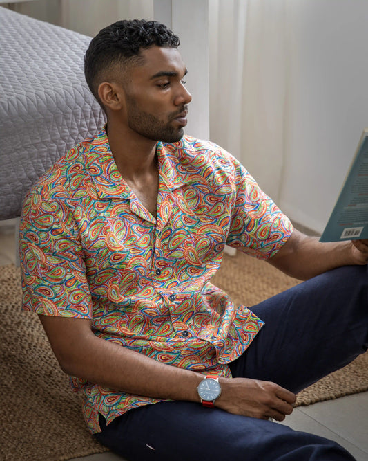 Model wearing NAD's paisley pattern shirt for men.