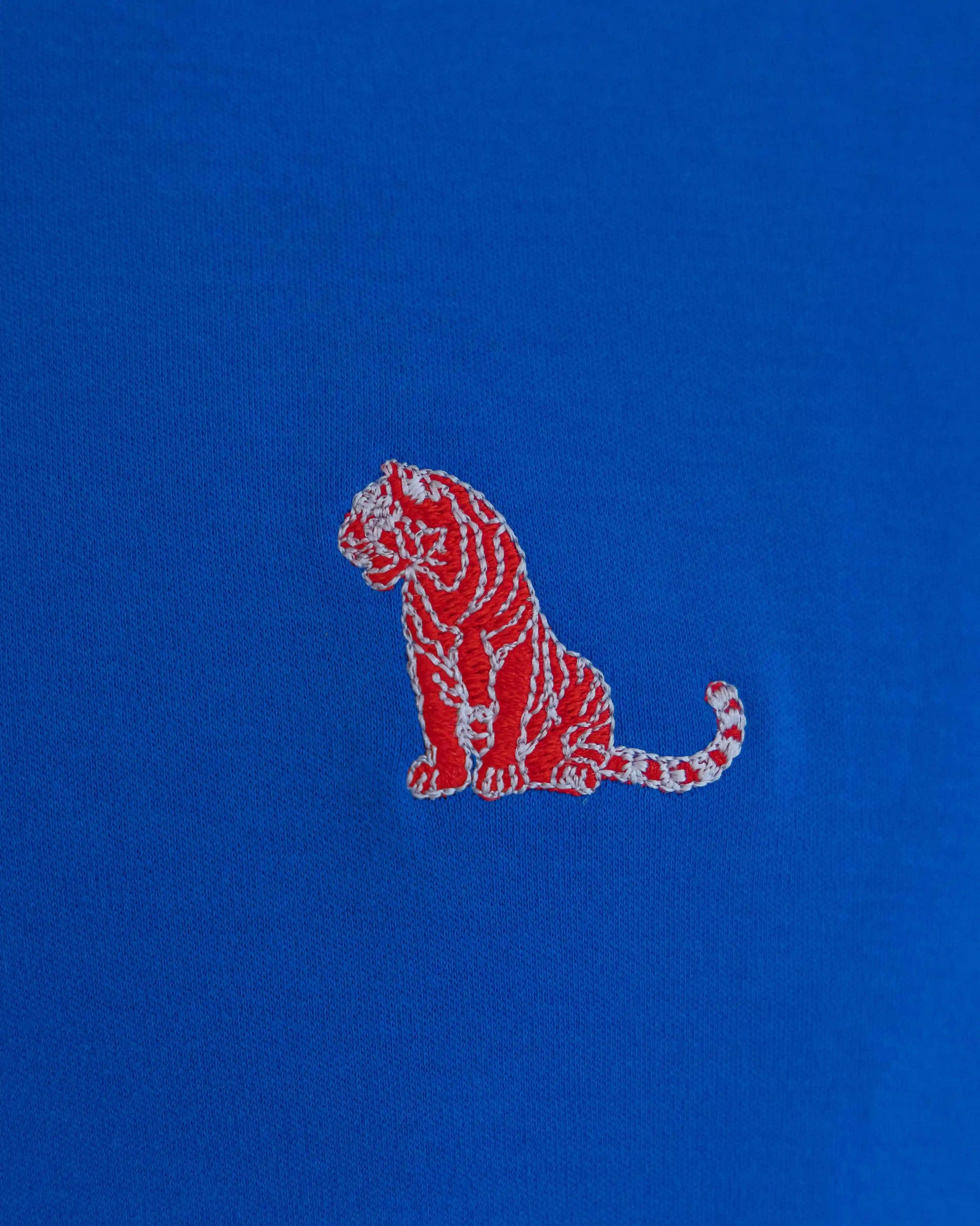 Embroidered tiger on NAD's royal blue cotton jersey crew t-shirt for men. 